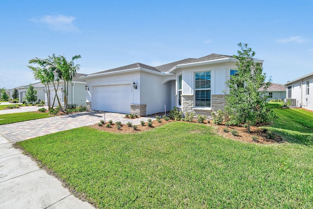 13526 Sw Vermillion Circle Mystique, Port Saint Lucie, FL 34987 - single story home featuring driveway, stucco siding, a garage, a front yard, and stone siding
