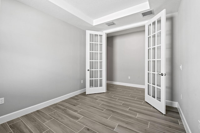 13526 Sw Vermillion Circle Mystique, Port Saint Lucie, FL 34987 - unfurnished room with french doors and wood tiled floors