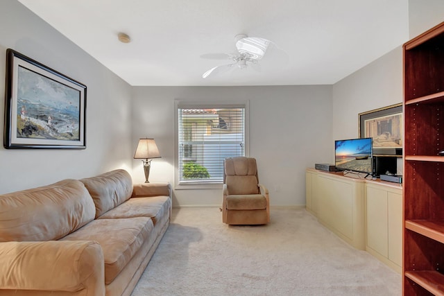 living room featuring ceiling fan and light colored carpet