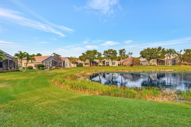 view of yard featuring a water view and a residential view