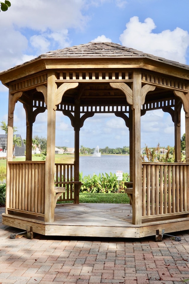 exterior space with a water view and a gazebo
