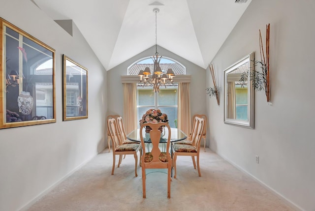 dining area featuring lofted ceiling, visible vents, a chandelier, and light colored carpet