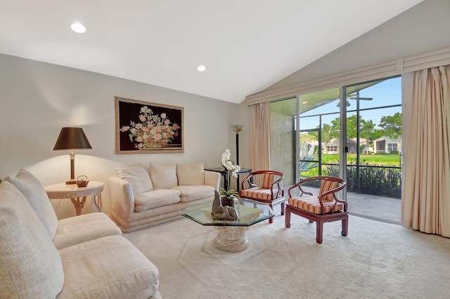 carpeted living area featuring lofted ceiling and recessed lighting