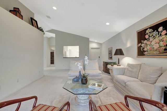 carpeted living area with visible vents, vaulted ceiling, and recessed lighting
