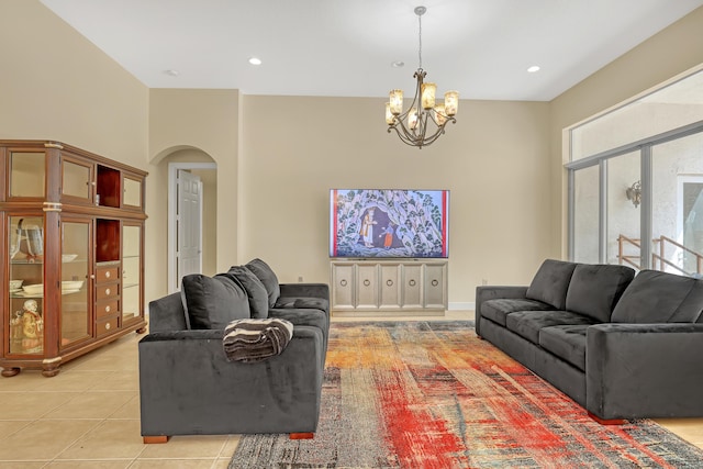 8888 Rockridge Glen Cv, Boynton Beach, FL 33473 - living room featuring light tile patterned floors, arched walkways, a chandelier, and recessed lighting