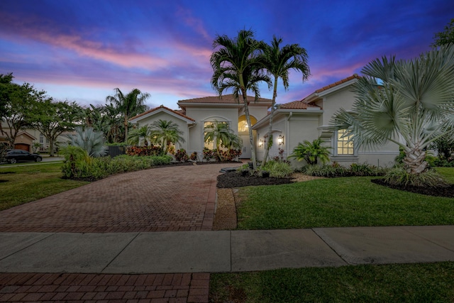 8888 Rockridge Glen Cv, Boynton Beach, FL 33473 - mediterranean / spanish-style house with stucco siding, a tile roof, a garage, and decorative driveway