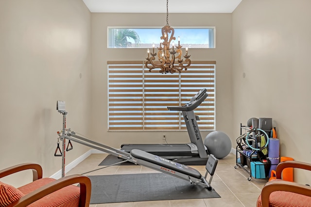 8888 Rockridge Glen Cv, Boynton Beach, FL 33473 - exercise area with baseboards and an inviting chandelier