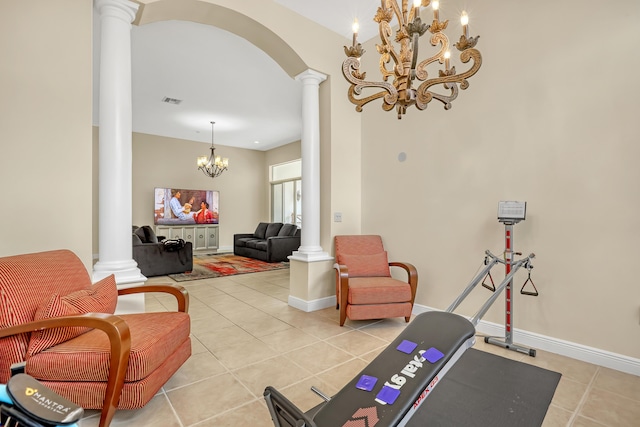 8888 Rockridge Glen Cv, Boynton Beach, FL 33473 - workout area featuring light tile patterned flooring, visible vents, ornate columns, baseboards, and an inviting chandelier