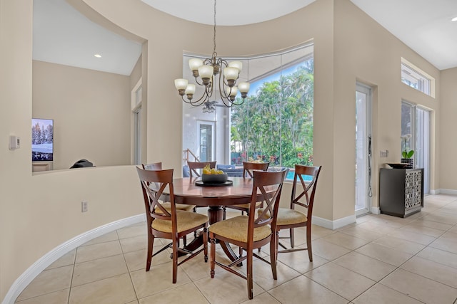 8888 Rockridge Glen Cv, Boynton Beach, FL 33473 - dining space featuring light tile patterned floors, a notable chandelier, and baseboards