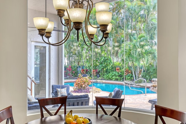 8888 Rockridge Glen Cv, Boynton Beach, FL 33473 - dining area with an inviting chandelier