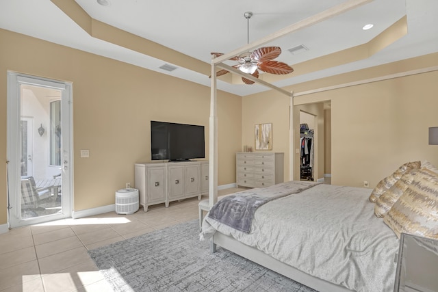 8888 Rockridge Glen Cv, Boynton Beach, FL 33473 - bedroom featuring a tray ceiling, tile patterned floors, visible vents, and baseboards