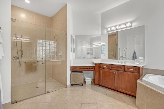 8888 Rockridge Glen Cv, Boynton Beach, FL 33473 - bathroom with vanity, a garden tub, tile patterned flooring, and a shower stall