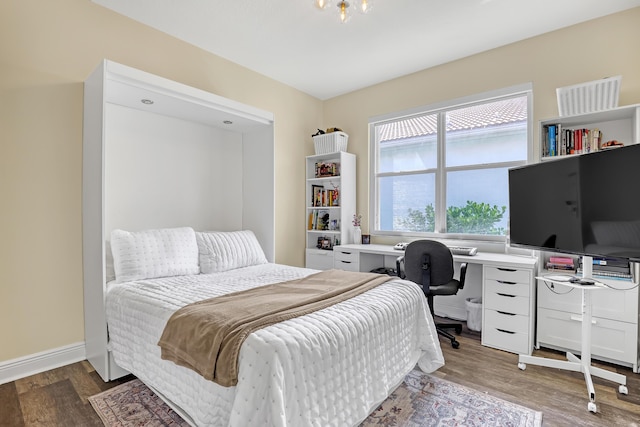 8888 Rockridge Glen Cv, Boynton Beach, FL 33473 - bedroom with baseboards and wood finished floors