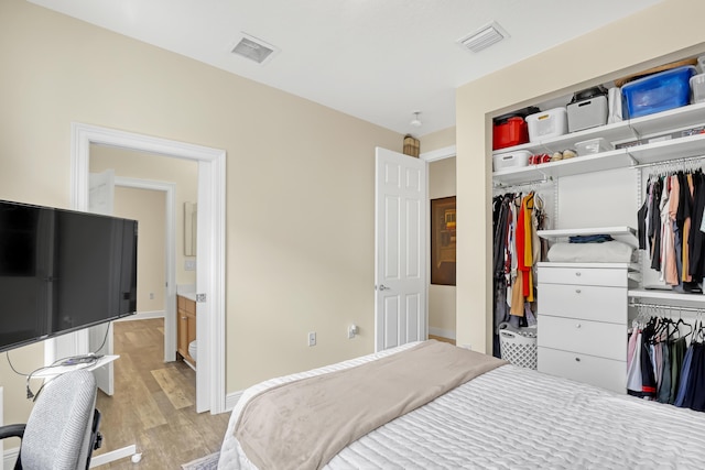 8888 Rockridge Glen Cv, Boynton Beach, FL 33473 - bedroom with a closet, baseboards, light wood-style floors, and visible vents