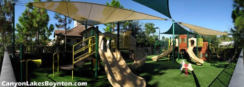 8888 Rockridge Glen Cv, Boynton Beach, FL 33473 - communal playground featuring a yard