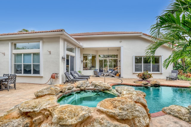 8888 Rockridge Glen Cv, Boynton Beach, FL 33473 - outdoor pool featuring an in ground hot tub and a patio area