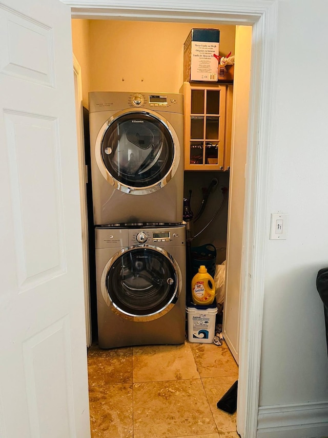 washroom with stacked washer and clothes dryer