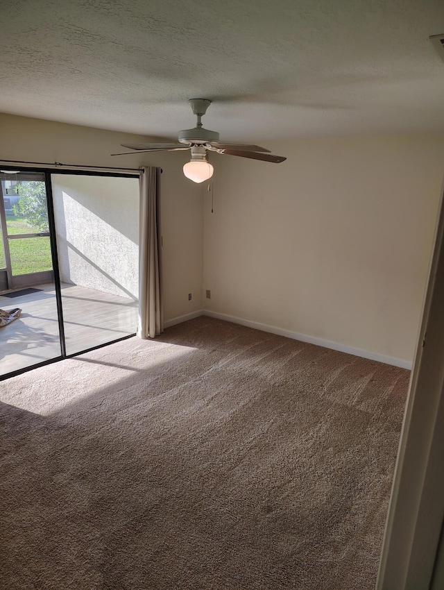 6020 Indrio Rd Unit 6, Fort Pierce, FL 34950 - unfurnished room with baseboards, a textured ceiling, a ceiling fan, and carpet