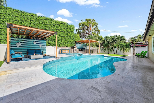 14283 Joan Dr, Palm Beach Gardens, FL 33410 - view of swimming pool with a patio area, a fenced backyard, and a pool with connected hot tub