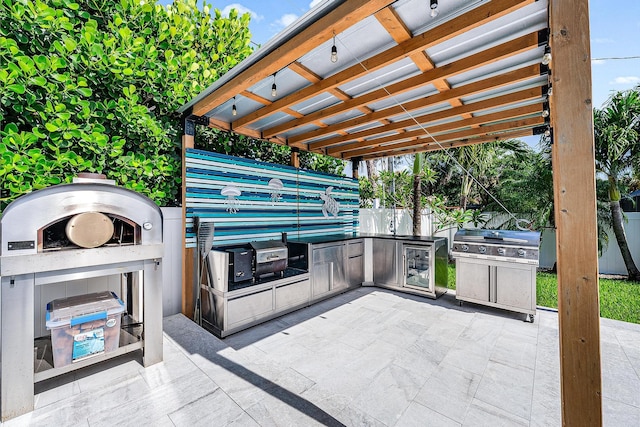 14283 Joan Dr, Palm Beach Gardens, FL 33410 - view of patio featuring an outdoor kitchen