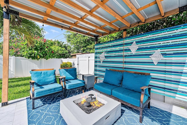 14283 Joan Dr, Palm Beach Gardens, FL 33410 - view of patio / terrace featuring an outdoor living space with a fire pit