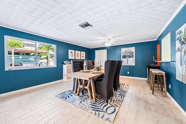 14283 Joan Dr, Palm Beach Gardens, FL 33410 - dining room with ornamental molding, wood finished floors, and ceiling fan
