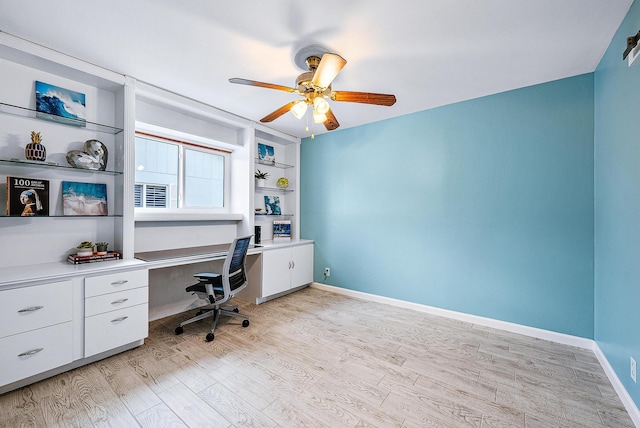 14283 Joan Dr, Palm Beach Gardens, FL 33410 - home office with a ceiling fan, light wood finished floors, and built in study area