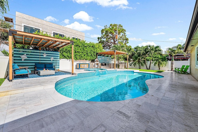 14283 Joan Dr, Palm Beach Gardens, FL 33410 - view of swimming pool featuring a patio, a fenced backyard, and a pool with connected hot tub