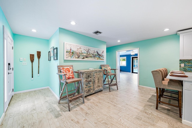 14283 Joan Dr, Palm Beach Gardens, FL 33410 - hall with light wood finished floors and recessed lighting