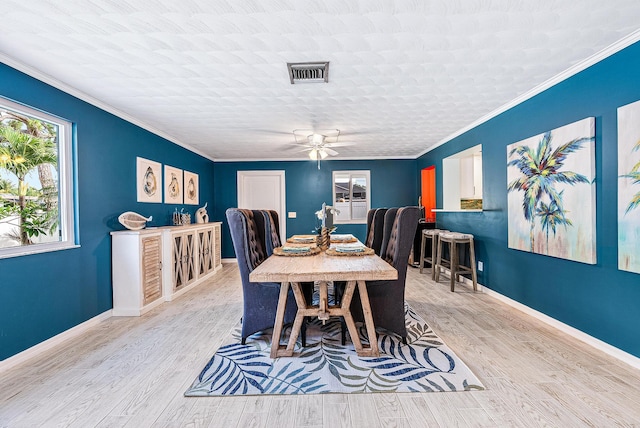 14283 Joan Dr, Palm Beach Gardens, FL 33410 - dining space featuring ceiling fan, ornamental molding, and wood finished floors