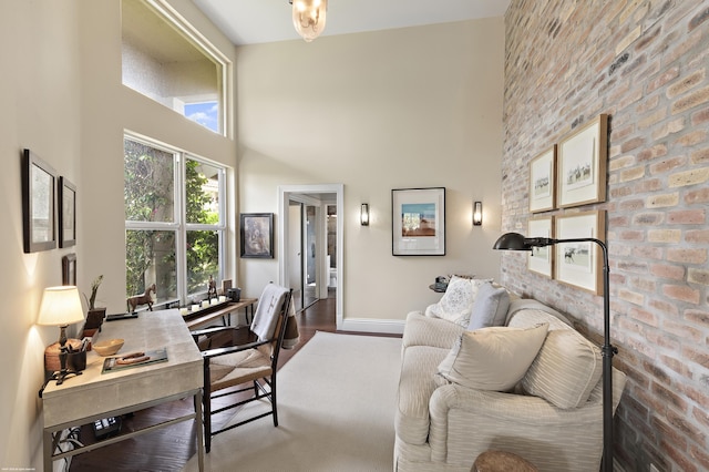 2990 Twin Oaks Way, Wellington, FL 33414 - home office with baseboards, a towering ceiling, and wood finished floors