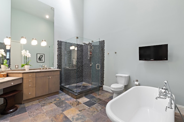 2990 Twin Oaks Way, Wellington, FL 33414 - full bath with vanity, stone tile floors, a freestanding tub, a high ceiling, and a stall shower