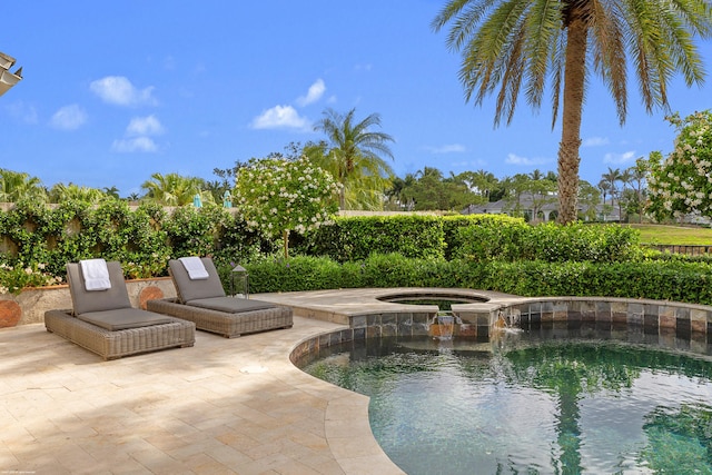 2990 Twin Oaks Way, Wellington, FL 33414 - view of swimming pool featuring a patio, an in ground hot tub, and a fenced in pool