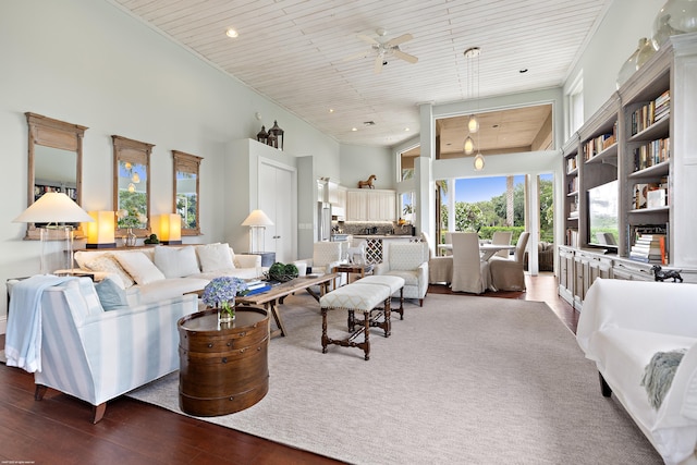 2990 Twin Oaks Way, Wellington, FL 33414 - living room with wood-type flooring, a ceiling fan, wood ceiling, and a high ceiling