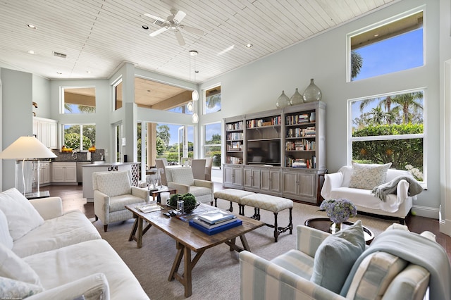 2990 Twin Oaks Way, Wellington, FL 33414 - living area featuring plenty of natural light, wood ceiling, a high ceiling, and ceiling fan
