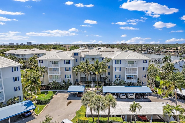 411 Bay Colony Drive N & Slip #32, Juno Beach, FL 33408 - view of property with a water view and uncovered parking