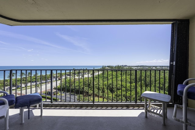 balcony featuring a water view