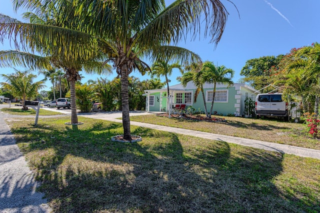 3899 Tuskegee Dr, Lake Worth, FL 33462 - view of front of house featuring a front yard