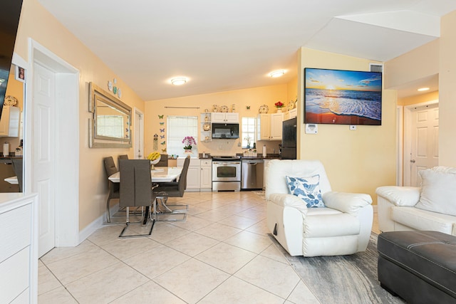 3899 Tuskegee Dr, Lake Worth, FL 33462 - living area with lofted ceiling and light tile patterned flooring