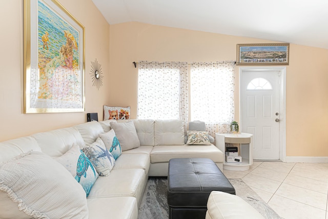 3899 Tuskegee Dr, Lake Worth, FL 33462 - living area featuring lofted ceiling, tile patterned floors, and baseboards