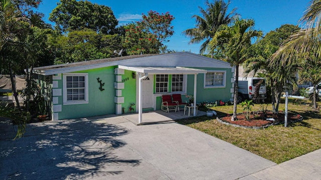 3899 Tuskegee Dr, Lake Worth, FL 33462 - view of front of house featuring a front yard