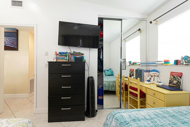 3899 Tuskegee Dr, Lake Worth, FL 33462 - bedroom with a closet, light tile patterned floors, and lofted ceiling