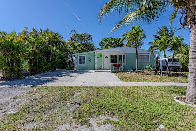 3899 Tuskegee Dr, Lake Worth, FL 33462 - view of front of property featuring a front yard