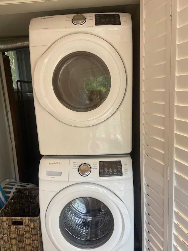 220 Malverne Rd, West Palm Beach, FL 33405 - laundry room featuring stacked washer and dryer and laundry area