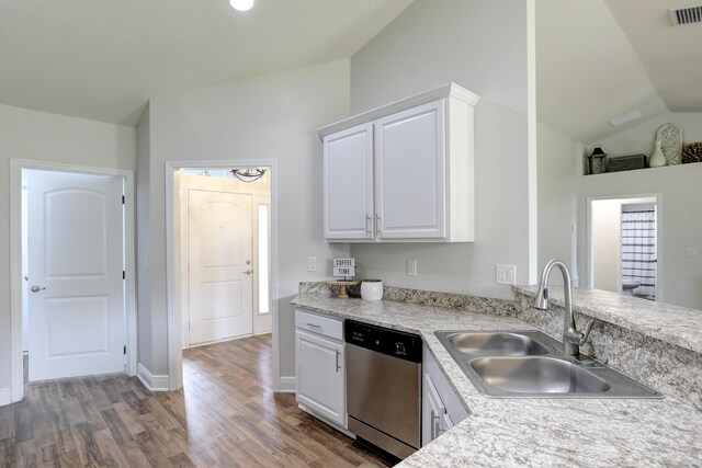 134 Day Dr, Sebastian, FL 32958 - kitchen featuring white cabinetry, stainless steel dishwasher, a sink, visible vents, and wood finished floors