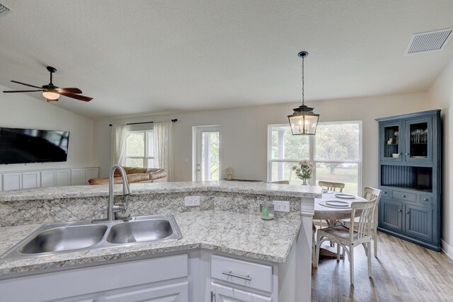 134 Day Dr, Sebastian, FL 32958 - kitchen featuring a sink, visible vents, a healthy amount of sunlight, and open floor plan