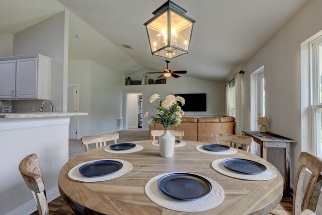 134 Day Dr, Sebastian, FL 32958 - dining space with baseboards, lofted ceiling, ceiling fan, and visible vents