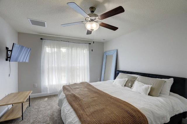 134 Day Dr, Sebastian, FL 32958 - carpeted bedroom with baseboards, a textured ceiling, visible vents, and ceiling fan