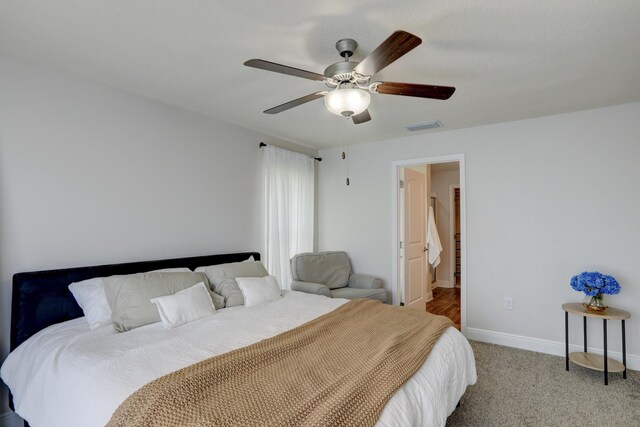 134 Day Dr, Sebastian, FL 32958 - bedroom with carpet flooring, a ceiling fan, baseboards, and visible vents