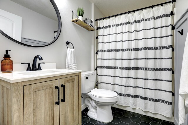 134 Day Dr, Sebastian, FL 32958 - full bathroom with toilet, tile patterned floors, vanity, and a shower with curtain